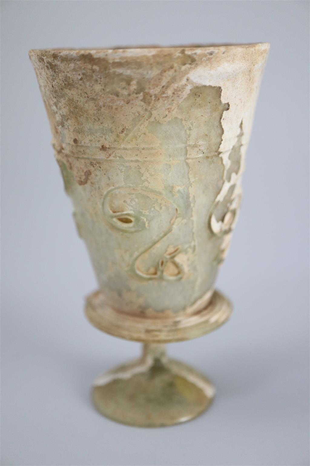 An Islamic colourless glass goblet, Iran, 12th century, 11.5cm high